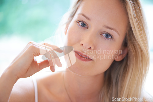 Image of Portrait, woman and dermatology in home with closeup for skincare, hydration and texture. Female person, looking and hair care with results of anti-aging with vitamin c, collagen or hyaluronic acid