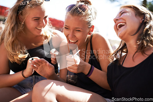 Image of Festival friends, happiness and women laughing at funny conversation, discussion joke or communication. Humour, comedy people and group wellness smile at social event, outdoor concert or reunion