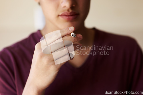 Image of Man, hand and cigarette closeup for smoking teen or unhealthy habit, dangerous or addiction. Male person, fingers and tobacco drag vice for stress management for lungs pain, bad problem of cancer