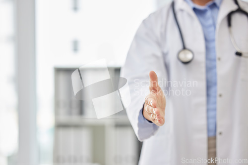 Image of Doctor, open handshake and welcome to hospital with respect, kindness or hiring in medical career. Medic person, introduction and palm for shaking hands for healthcare, onboarding or hello in clinic