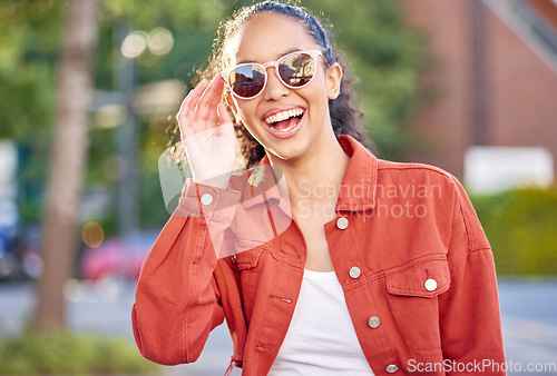 Image of Woman, portrait and smile in city for travel in summer vacation, street explore or downtown. Female person, face and sunglasses for relax outdoor weekend or tourist in town, holiday walking on trip