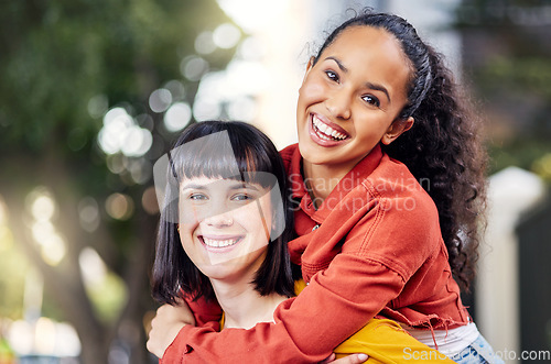 Image of Couple of friends, lesbian and piggyback portrait outdoor for fun, travel and happiness or love on vacation. Young people in city for holiday or playful trip with a smile and joy to hangout in summer