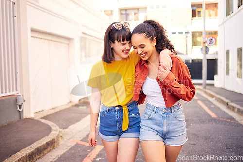 Image of Happy, love and lesbian couple walking in the city for sightseeing, exploring and adventure. Smile, romance and young interracial lgbtq women bonding for travel together in urban town street or road.