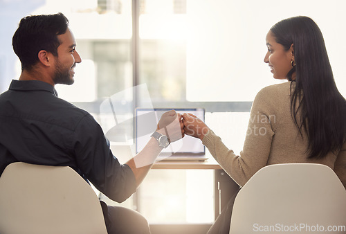 Image of Man, woman and business fist bump for meeting laptop or partnership, winning or goal strategy. Colleagues, hands and happy company office in collaboration trust for mission deal, career for target