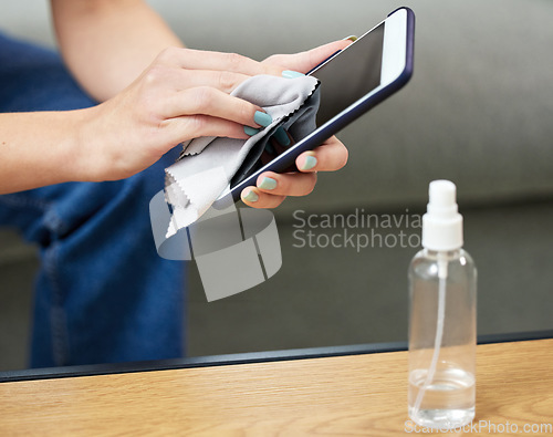 Image of Woman, hand and clean phone screen or wipe hygiene bacteria, dust wellness or virus safety. Female person, mobile device and cloth for disinfection from germs or surface sanitizer, protection or risk