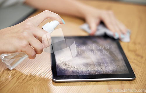 Image of Hands, spray tablet and cleaning with wipe, dust and dirt with shine on screen, hygiene and cloth in home. Woman, digital touchscreen and fabric, chemical and sanitation for bacteria, virus and glass