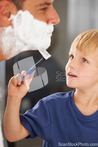Image of Shaving, father and son with cream, razor and smile on face, bonding in home and morning routine. Helping, learning and dad with happy child in bathroom for shave, clean fun and grooming together.
