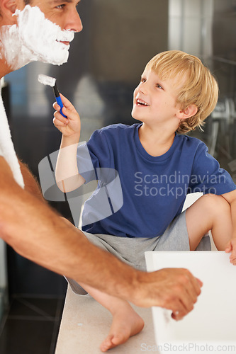 Image of Shaving, dad and child with cream, razor and smile on face for bonding in home with morning routine. Help, fun and father with happy son in bathroom for facial shave, cleaning and grooming together.