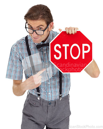 Image of Portrait, stop sign and a man nerd pointing in studio isolated on a white background to direct traffic. Safety, law or legal with a young geek in glasses showing a road warning for speed danger