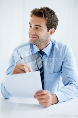 Image of Business man, thinking and writing on paperwork for financial report, audit review and asset management in office. Auditor, accountant or mature person with policy, contract signature or documents