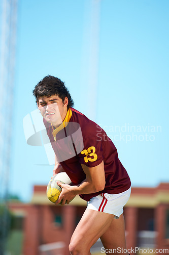 Image of Fitness, man and sports with rugby, ball or pass at a field for training, match or hobby outdoor. Football, face and male athlete at a park for game day, performance or workout, skill or practice