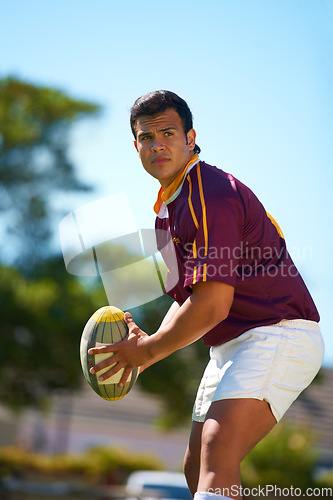 Image of Fitness, sports and man with rugby, ball or pass at a field for training, match or hobby outdoor. Football, face and male athlete at a park for game day, performance or workout, skill or practice