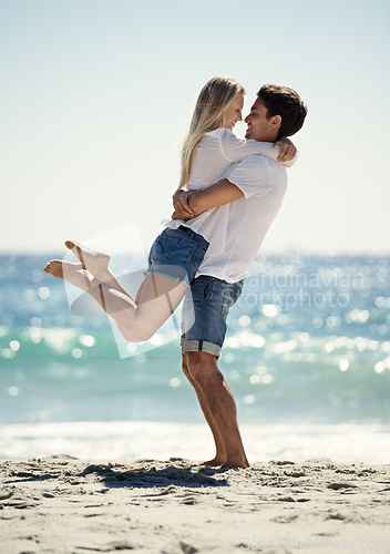 Image of Couple, hug and fun by beach in summer with love, care and support together on a holiday. Happy, vacation and date smile by the sea in Miami with freedom and travel by the ocean on a trip outdoor