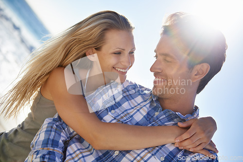 Image of Couple, hug and smile outdoor at beach in summer sunshine for vacation, thinking and memory on travel. Man, woman and happy with love, bonding and holiday by ocean for adventure in Naples, Italy