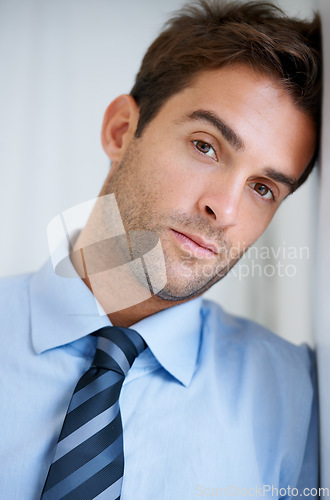 Image of Businessman, portrait and serious in office for career, professional and employee at corporate job. Entrepreneur, face or person for assertive, confidence and pride with calm expression at workplace