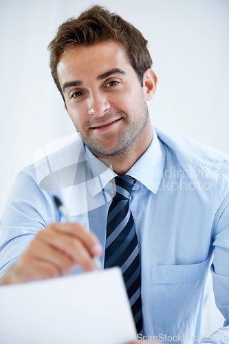 Image of Business man, portrait and documents or writing information in POV job interview or recruitment meeting in HR. Smile, face and professional employer with documents, resume and CV or hiring contract