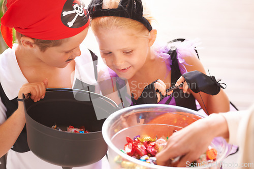 Image of Siblings, trick o treat and halloween costume outdoor, sweets and happiness in community. Boy, girl or smile face for holiday with candy bucket, collect chocolates and fairy or pirate by neighbours