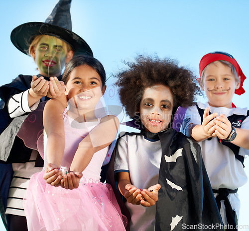 Image of Children, group and portrait for halloween costume for sweet candy asking, trick or treat for fantasy. Friends, hands or dress up as witch or pirate for holiday fun or kid development, smile for play