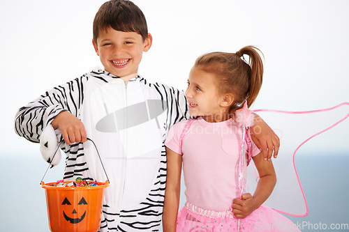 Image of Family, children and siblings with halloween, costume or hug outdoor with love, care or fun together. Happy, smile and kids in character for festival, holiday or fantasy, playing or bond with freedom