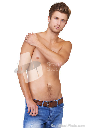 Image of Man, portrait and serious in studio with topless, jeans and confident for wellness, health and calm expression. Person, face and shirtless with hands or assertive on mock up space or white background