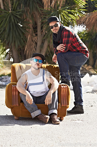 Image of Couch, hipster and portrait of men in city in hip hop fashion, trendy clothes and casual outfit. Friends, sunglasses and people on sofa in street for urban neighborhood culture, streetwear and gang