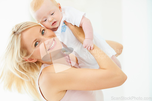 Image of Mother, baby and smile for play, lift and child development or love, security and bonding in portrait. Mom, daughter and connection or fun, joy and care in motherhood, happiness and airplane game