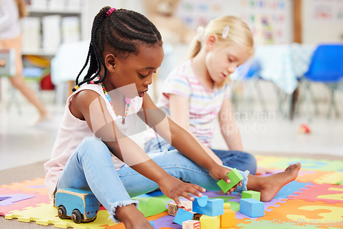 Image of Education, kindergarten and children with toys for playing, child development and creative learning. School, youth and young girls with building blocks for fun, relax and educational games on floor