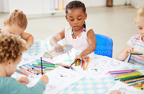 Image of Black kid, pencil and drawing for homework in classroom with creative, art or project for picture. Little girl, serious look and choice of color for learning, education or development of motor skills