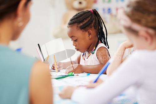 Image of African, kid and pencil for drawing in classroom for learning, education and development of motor skills. Little girl, student on learner with serious, determination and look for creative activity