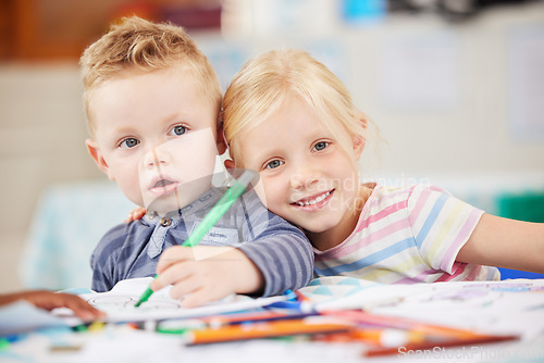 Image of Face, kid or friend with drawing in classroom for learning, education and development of motor skills. Little girl, boy or student with smile for art project, homework or assessment in kindergarten