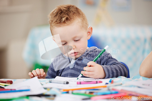 Image of Face, kid and pencil for drawing in classroom for learning, education and development of motor skills. Little boy, student or learner with coloring activity for growth, future or milestone in daycare
