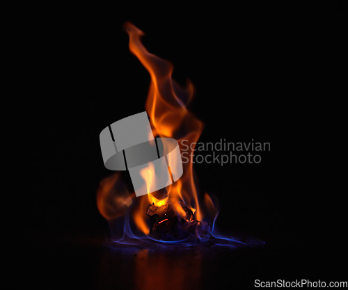 Image of Gas flame, heat and fire with black background with night, start and light from burning in studio. Fuel, flare and glow from thermal power and art in the dark with creativity and inferno with burn