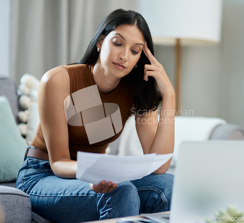 Image of Frustrated woman, documents and headache for debt, stress or mistake in burnout on living room sofa at home. Female person with paperwork or migraine in anxiety for financial crisis or bills at house