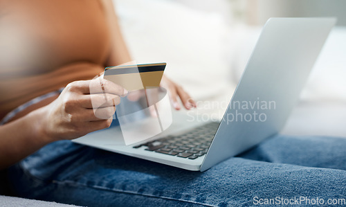 Image of Laptop, credit card and hands for home online shopping, e commerce and digital payment or order on sofa. Relax person typing on computer for internet banking, subscription or registration for a loan