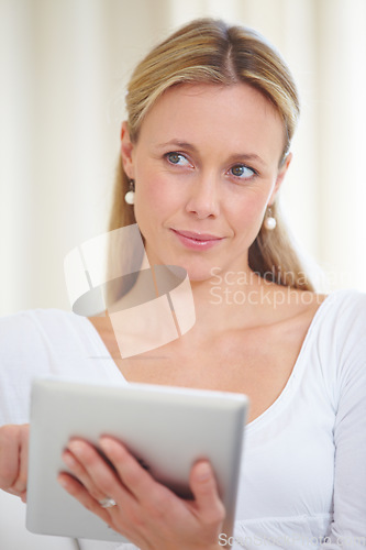 Image of Mature woman, tablet and thinking in home, serious face and living room couch. Social media, technology and communication for scrolling, vision and idea with connection, streaming and contemplating