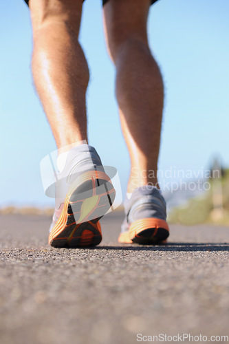 Image of Man, shoes and legs running on road for fitness, workout or outdoor exercise on asphalt. Closeup of male person or athlete on street with sneakers for run, cardio or floor grip in health and wellness
