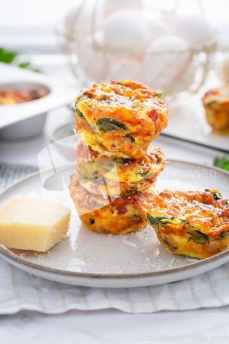 Image of Homemade healthy spinach and cheese egg muffins, high protein and low carb breakfast