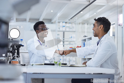 Image of Smile, fist bump and men in laboratory for celebration, deal success or onboarding welcome. Teamwork, medical research and scientist in partnership, collaboration or introduction for happy doctors.