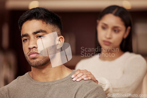 Image of Divorce, fight and couple in a house with stress, worry or fear of infertility crisis in their home together. Marriage, conflict and sad man reject toxic woman in living room with argument or dispute