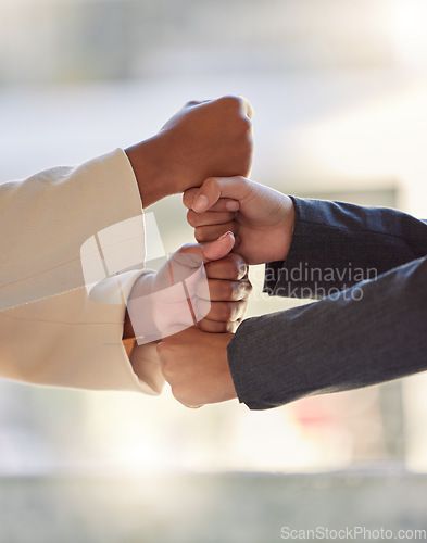 Image of Fist, business people and hands stack for teamwork, support and winning collaboration in office. Closeup, employees and building partnership together for solidarity, motivation and celebrate success