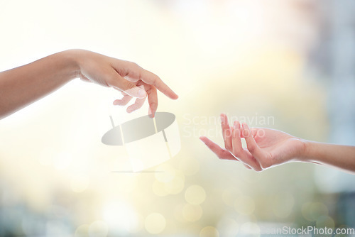 Image of Helping hand, people and giving for support with bokeh, hope and empathy for healing or mental health. Hands, reaching and donation for charity, kindness and compassion with humanity and assistance