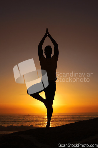 Image of Silhouette, man and namaste with hands for yoga, health and wellness on beach with sunset and zen. Person, shadow and pilates or praying for balance, mindfulness and healthy body by ocean or sea