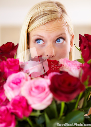 Image of Woman, rose bouquet and eyes with closeup, beauty and arrangement with studio background, surprise and gift. Look, female model and flowers for love, present and valentines day with romantic gesture