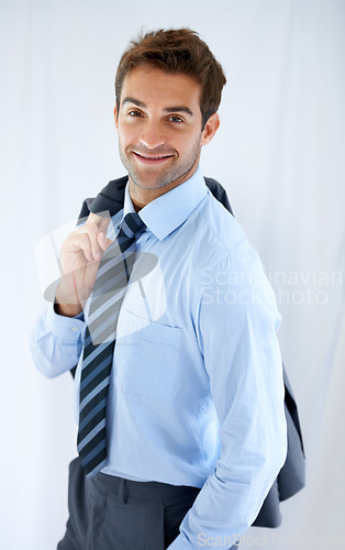 Image of Businessman, portrait and smile in office for career, professional and employee at corporate job. Entrepreneur, face and person for happy, confidence and pride with calm expression or blazer at work
