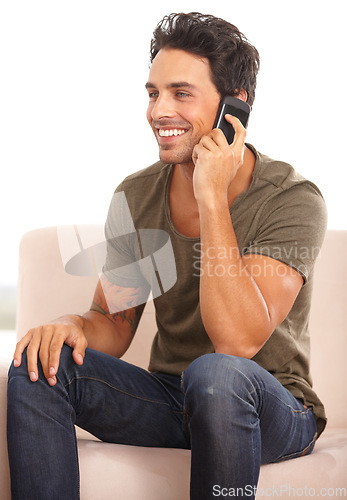 Image of Phone call, communication and smile with man on sofa for contact, networking and social media. Conversation, technology and connection with person in living room at home for mobile and online