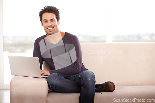 Image of Man, work from home and portrait on laptop for stock market investment, planning and research on website and sofa. Startup freelancer or trader relax on a couch with his computer and trading software
