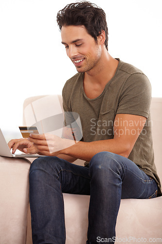 Image of Credit card, computer and man on sofa for online shopping, e commerce and digital payment and home fintech. Person on couch, typing on laptop and internet banking for financial investment or sale