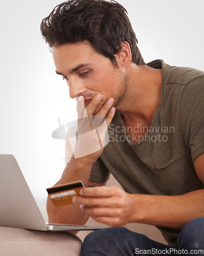 Image of Man, stress and credit card on laptop for home online shopping, e commerce mistake or payment error. Shocked person check wrong balance, phishing warning and cybersecurity risk of banking on computer