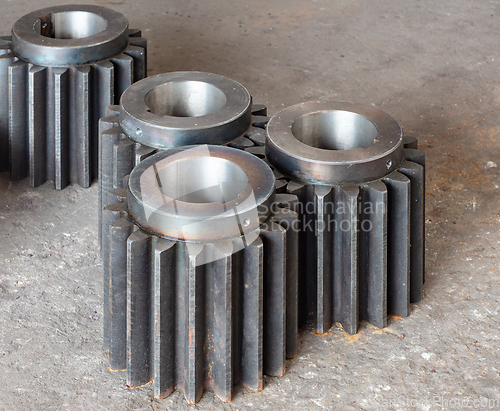 Image of Large cogwheels on a factory floor