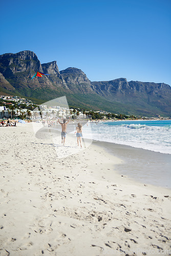 Image of Love, kite and couple on beach, running on date for outdoor bonding and tropical holiday. Romance, man and woman at sea, fun and relax on ocean vacation together with travel, care and play adventure.